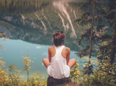 women's white tank top on top of the hill